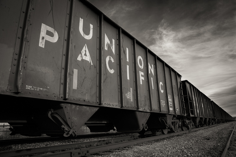 Black and white Union Pacific train on railroad tracks in Orem, UT