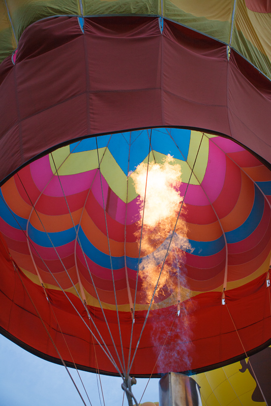 Fire filling a multicolored hot air balloon at the Provo, Utah Freedom Festival on the 4th of July, Independence Day